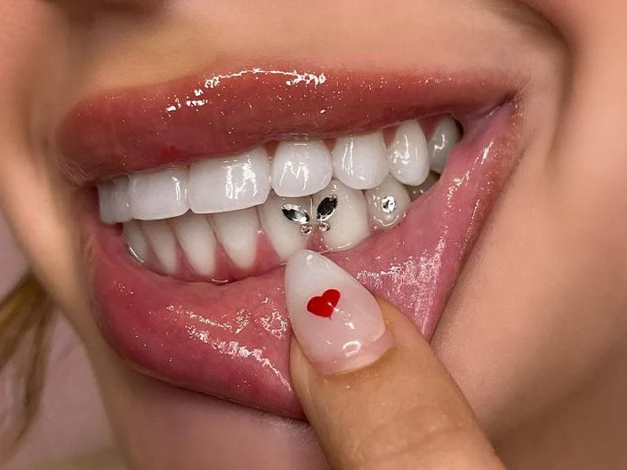 Smile with delicate tooth gem accents